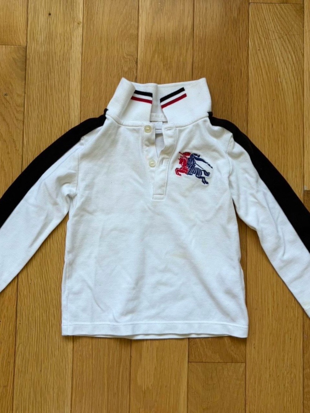 Burberry White Polo with Black Sleeve Panels and Red/Blue Crest